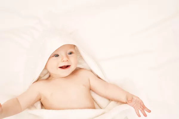 Cute Small Boy Lying At Bed Childhood Bath Concept Light Background Smiling Child Happy